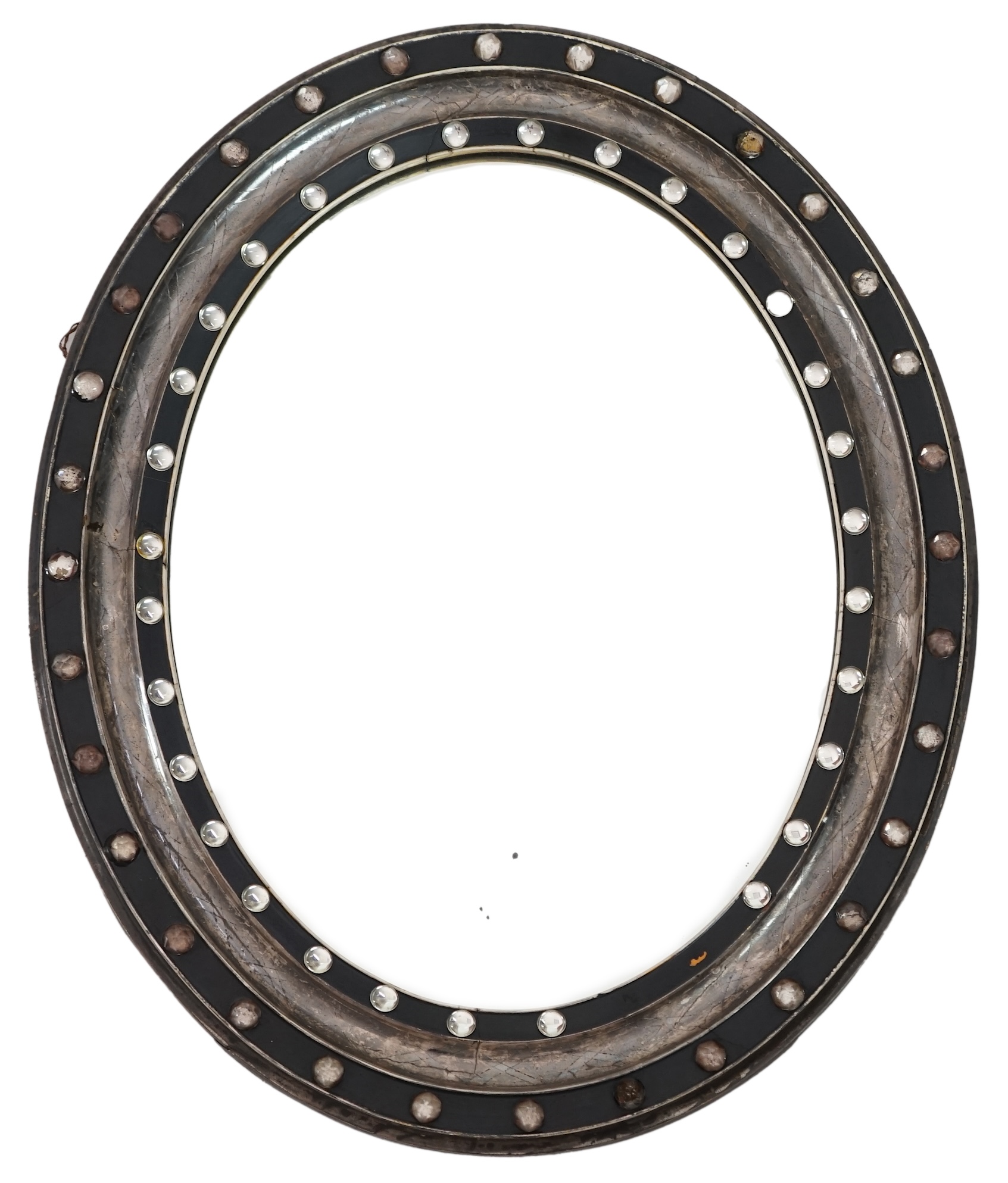 A 19th century Irish ebonised and silvered frame oval wall mirror